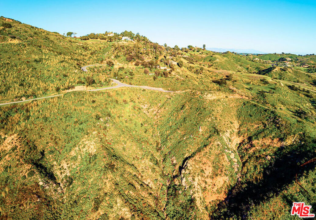 2825 Tuna Canyon Road Topanga, CA 90290 - Photo 16 of 38 a view of a large building with mountains in the background