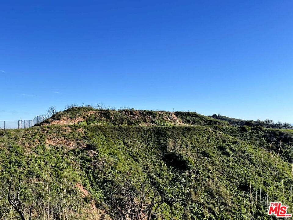 2825 Tuna Canyon Road Topanga, CA 90290 - Photo 33 of 38 a view of a large building with a lush green field