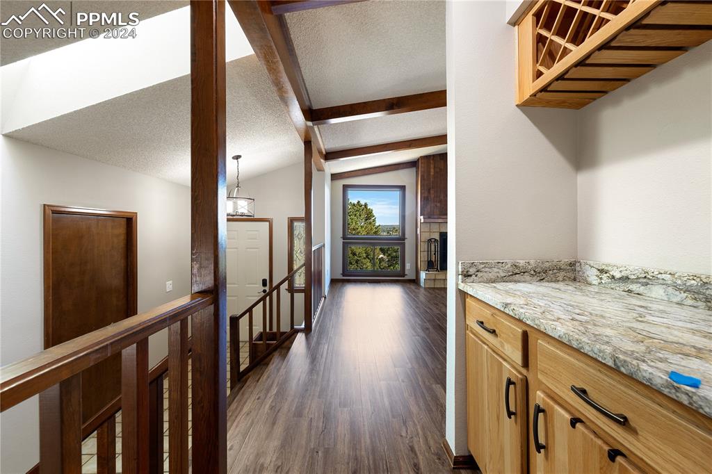 1125 Garlock Lane Colorado Springs, CO 80918 - Photo 18 of 49 a view of a hallway view with wooden floor and staircase