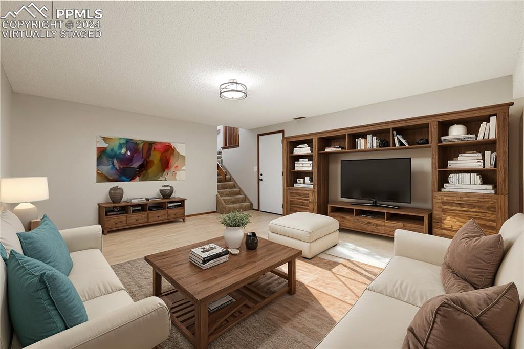 1125 Garlock Lane Colorado Springs, CO 80918 - Photo 21 of 49 a living room with furniture and a flat screen tv