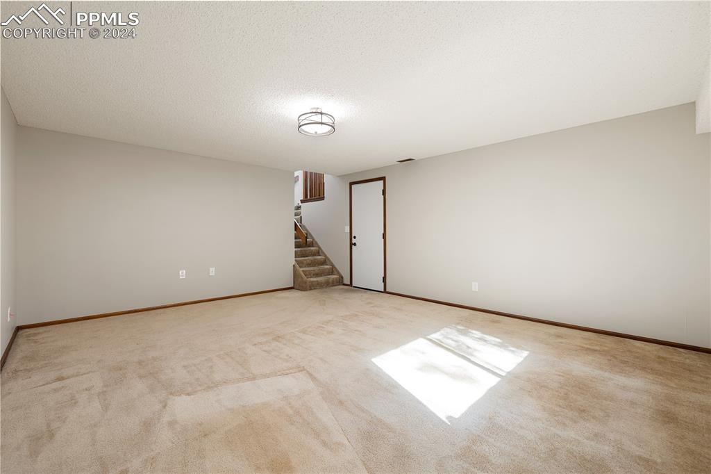 1125 Garlock Lane Colorado Springs, CO 80918 - Photo 22 of 49 an empty room with windows