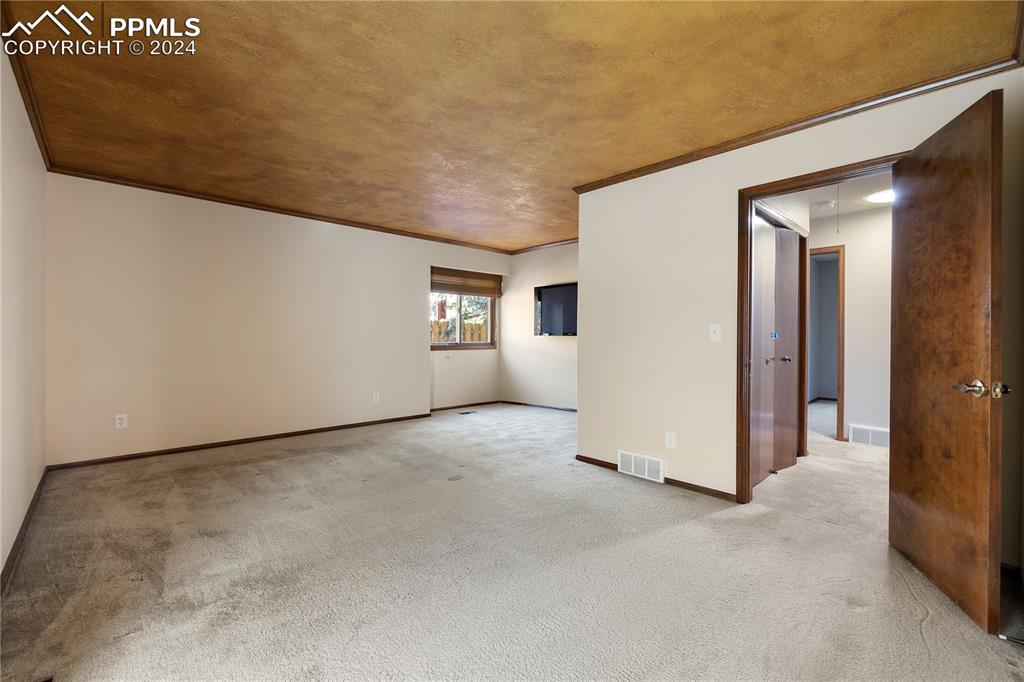 1125 Garlock Lane Colorado Springs, CO 80918 - Photo 25 of 49 an empty room with windows