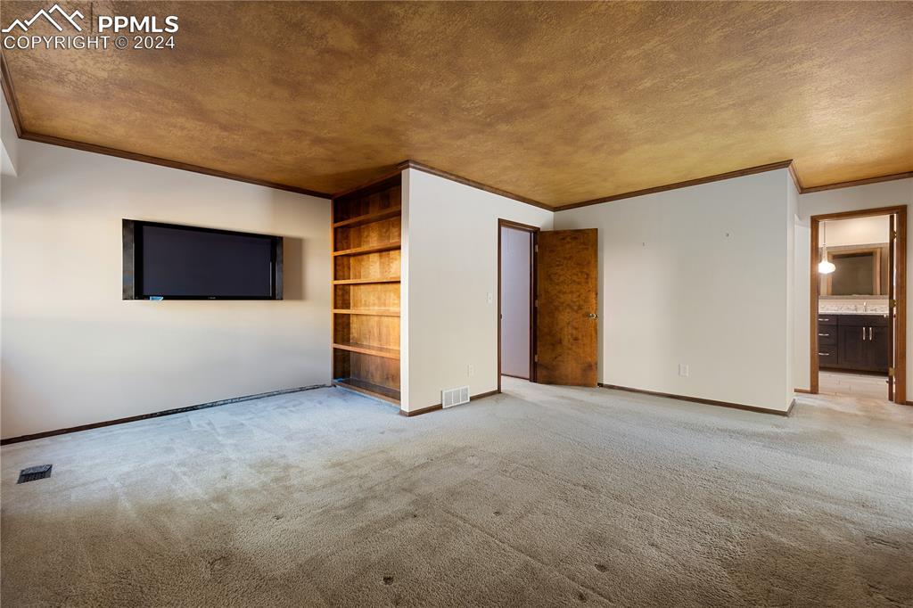 1125 Garlock Lane Colorado Springs, CO 80918 - Photo 27 of 49 a view of empty room with wooden floor