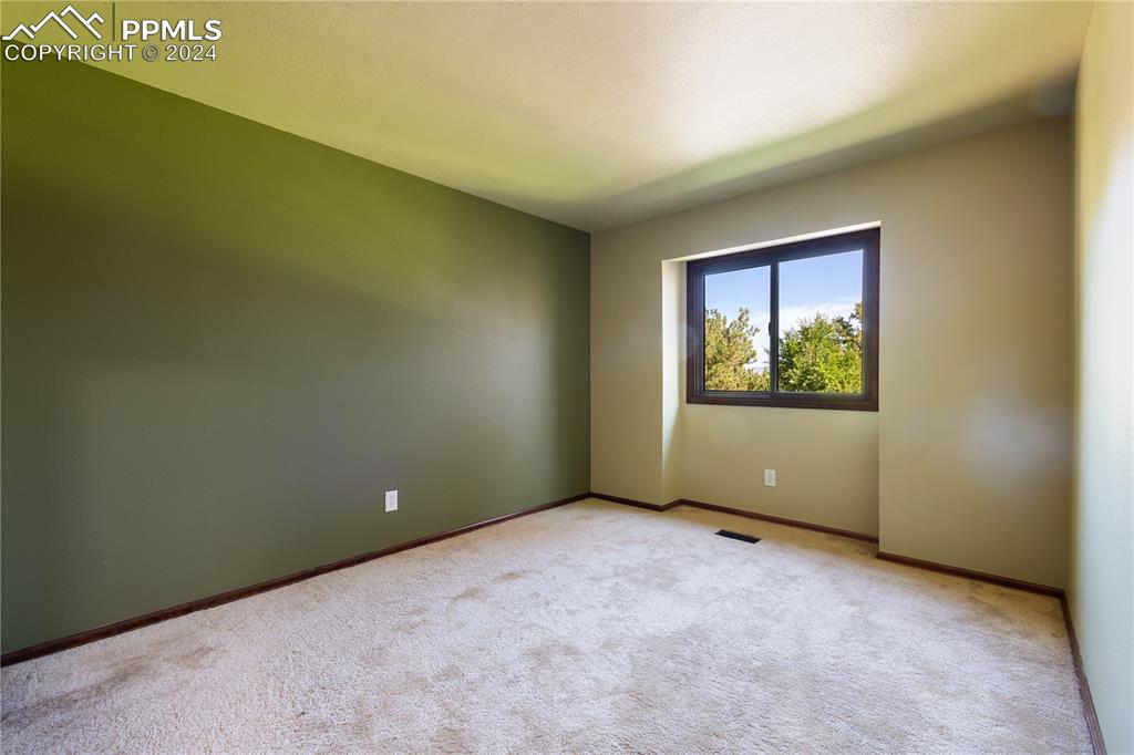 1125 Garlock Lane Colorado Springs, CO 80918 - Photo 32 of 49 an empty room with windows