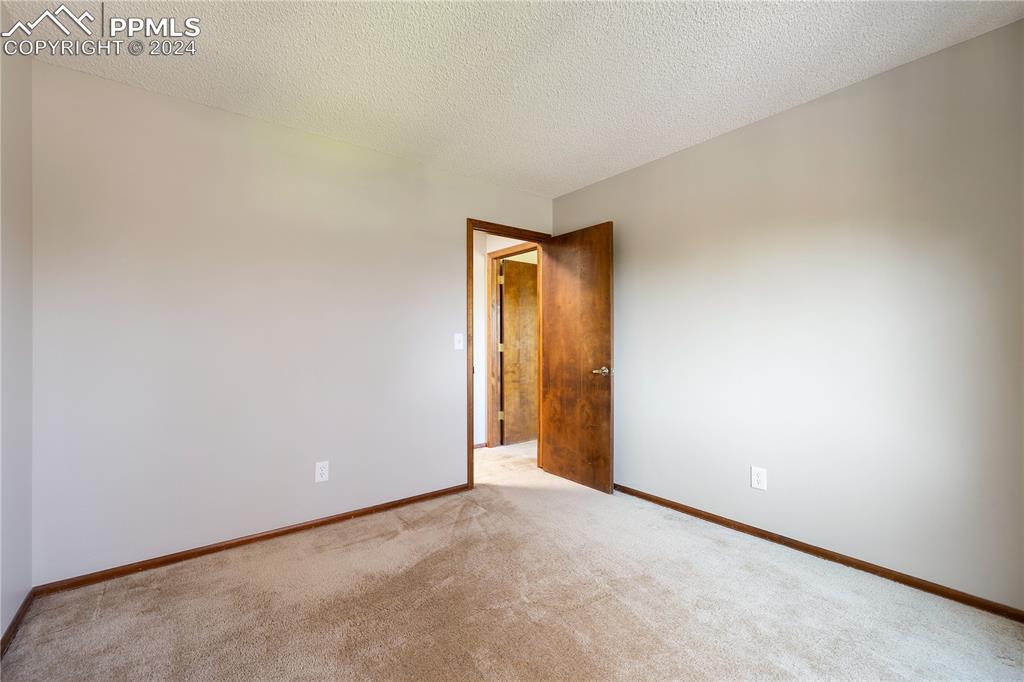 1125 Garlock Lane Colorado Springs, CO 80918 - Photo 38 of 49 a view of an empty room and a window