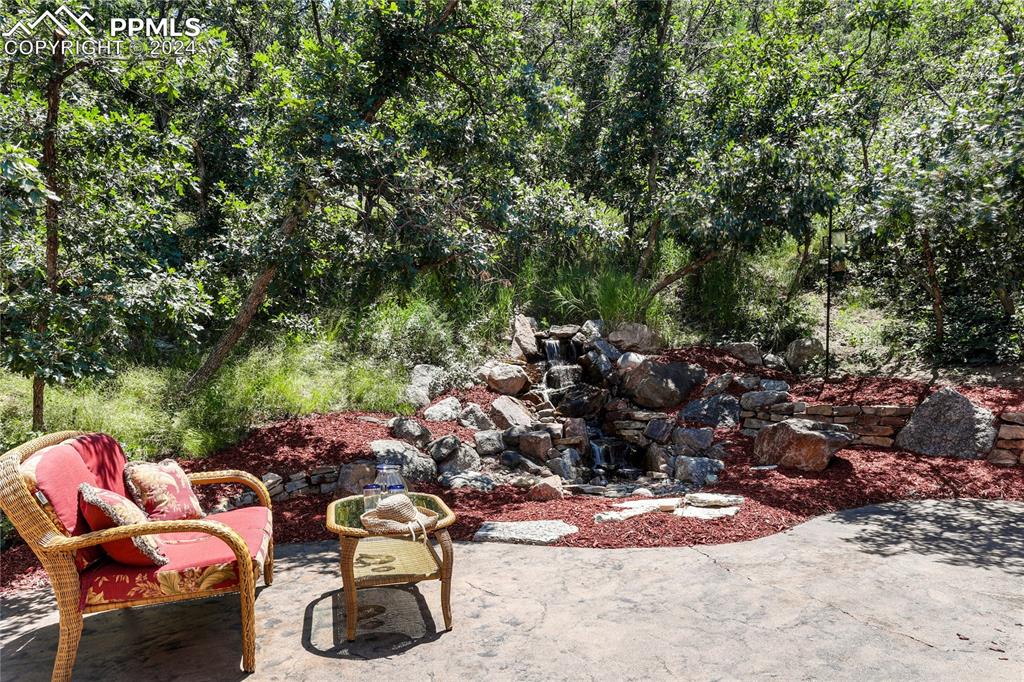 1125 Garlock Lane Colorado Springs, CO 80918 - Photo 41 of 49 a view of a backyard with table and chairs