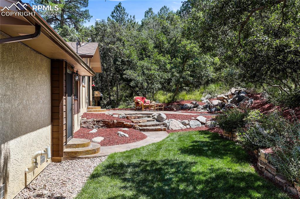 1125 Garlock Lane Colorado Springs, CO 80918 - Photo 44 of 49 a view of swimming pool with a patio