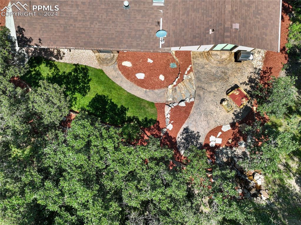 1125 Garlock Lane Colorado Springs, CO 80918 - Photo 45 of 49 an aerial view of a house with a yard and garden