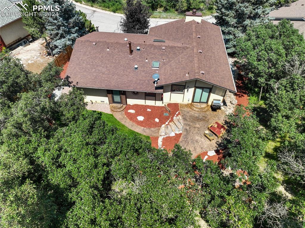 1125 Garlock Lane Colorado Springs, CO 80918 - Photo 46 of 49 an aerial view of a house with a yard and a large tree