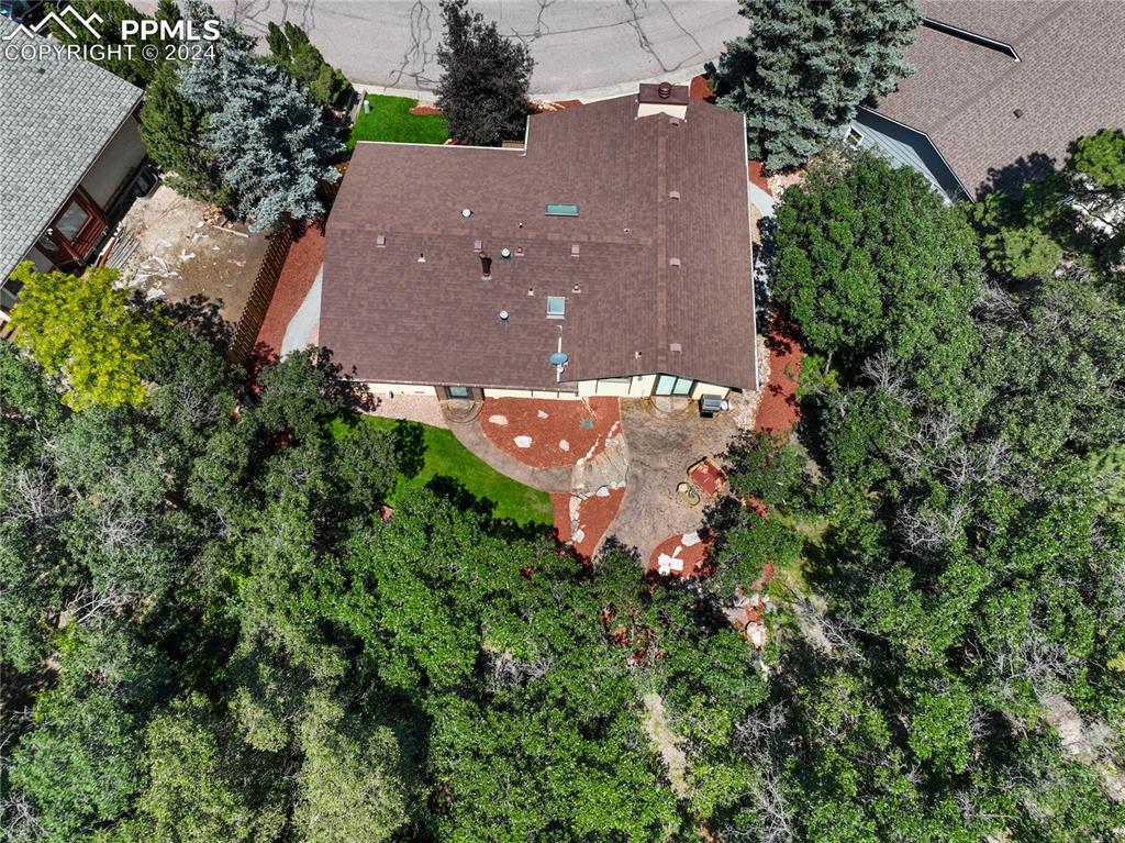 1125 Garlock Lane Colorado Springs, CO 80918 - Photo 47 of 49 an aerial view of a house with a yard and a garden