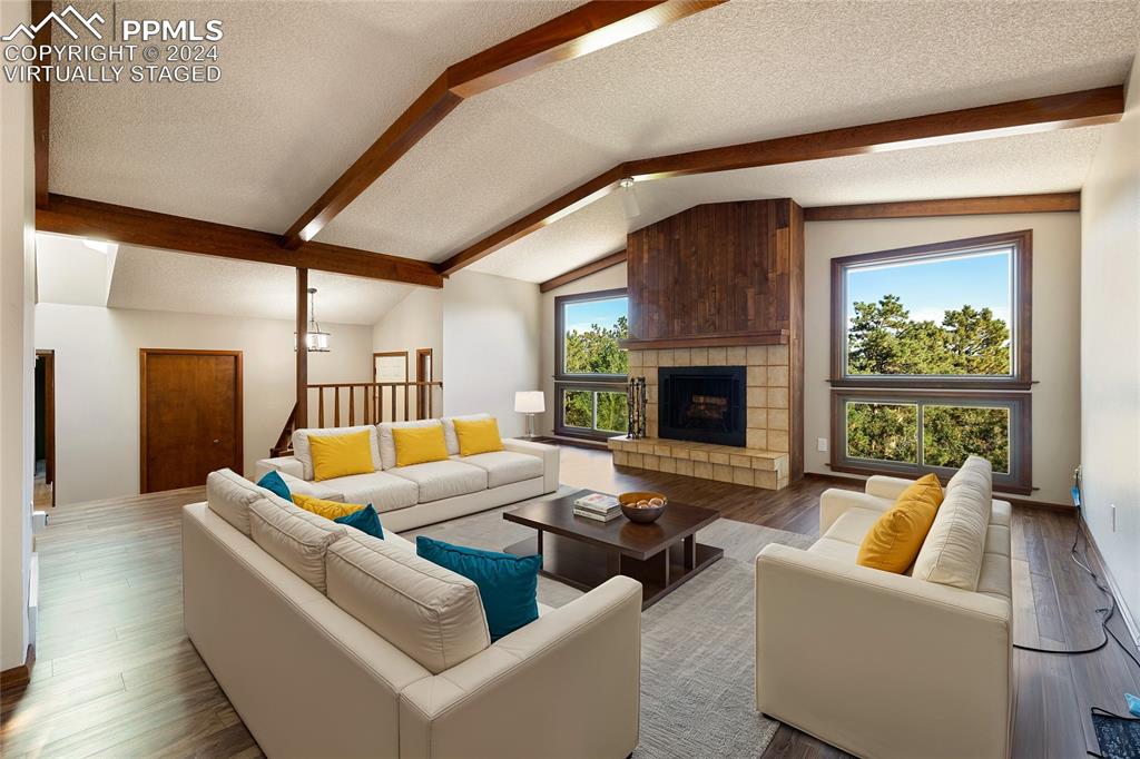1125 Garlock Lane Colorado Springs, CO 80918 - Photo 6 of 49 a living room with furniture and a fireplace