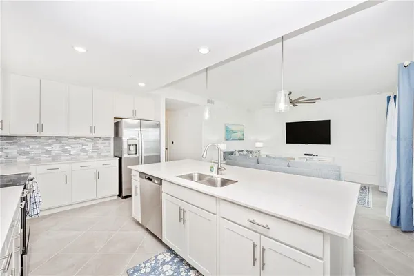 a view of a dining room with furniture and a large window