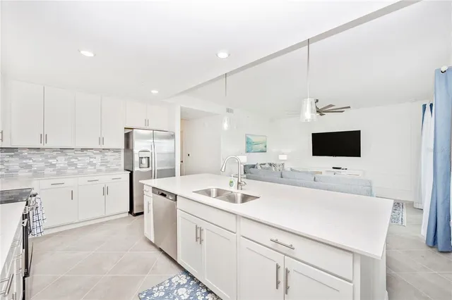 a view of a dining room with furniture and a large window