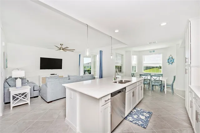 a view of a dining room with furniture and a window