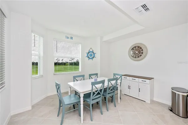 a living room with furniture white walls and white walls