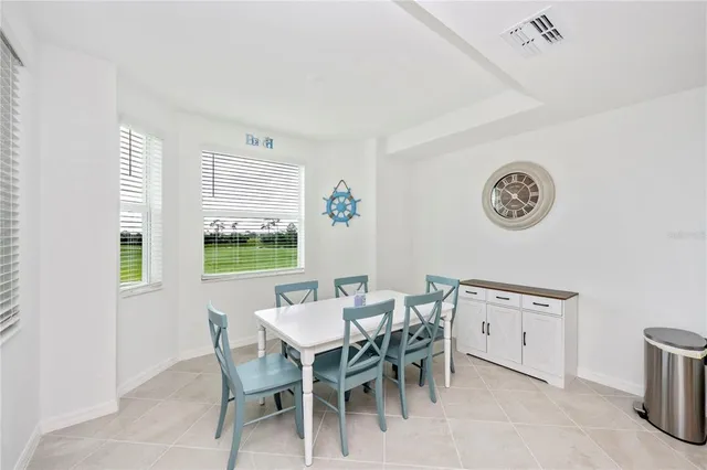 a living room with furniture white walls and white walls