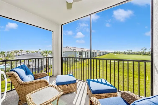 a bathroom with a granite countertop sink a toilet and a large mirror