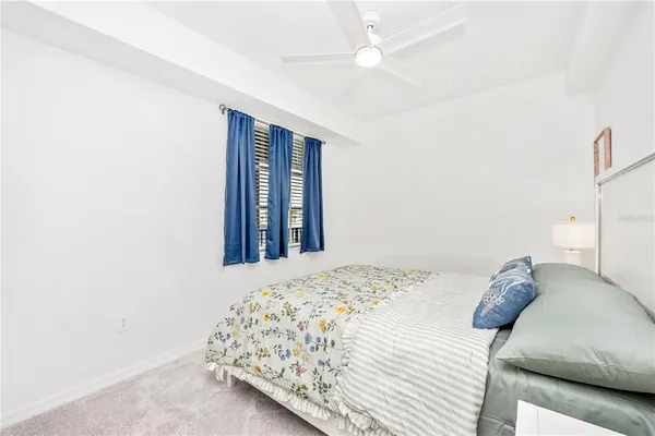 a view of a room with gym equipment and a large window