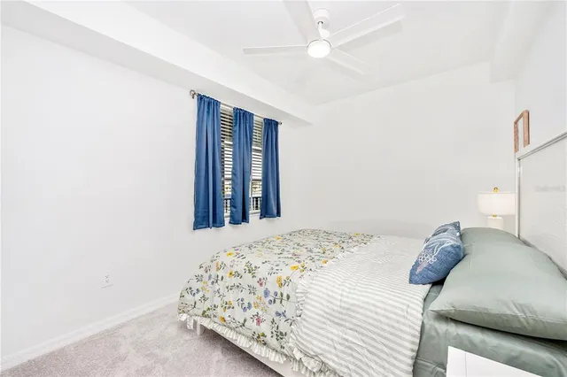 a view of a room with gym equipment and a large window