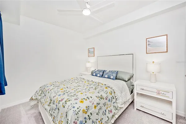 a front view of a house with glass windows and furniture