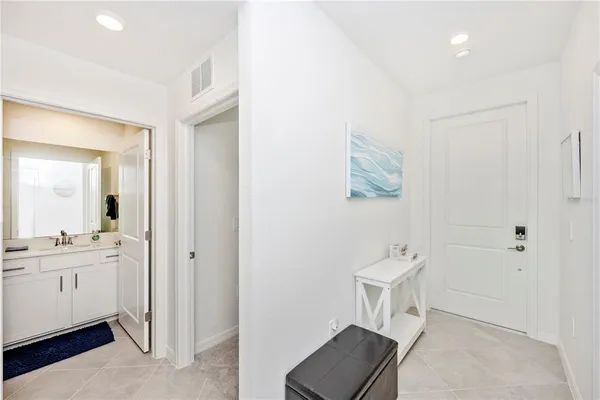 a kitchen with appliances a sink and cabinets