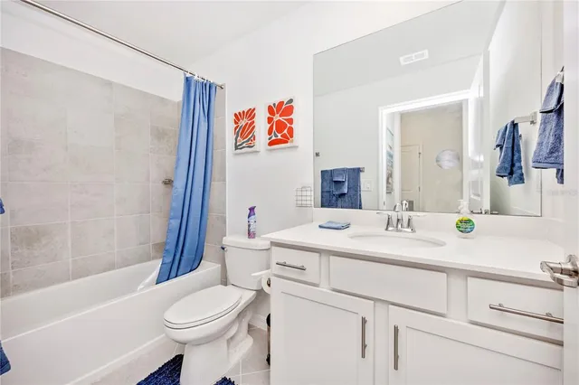 a living room with lots of furniture and a chandelier