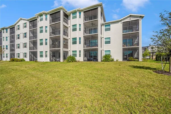 a view of a house with backyard porch and sitting area