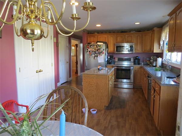 16 Winifreds Way Rutland, MA 01543 - Photo 4 of 22 a kitchen with stainless steel appliances granite countertop a stove refrigerator and cabinets