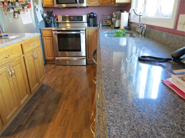16 Winifreds Way Rutland, MA 01543 - Photo 6 of 22 a view of a kitchen with a sink and cabinets
