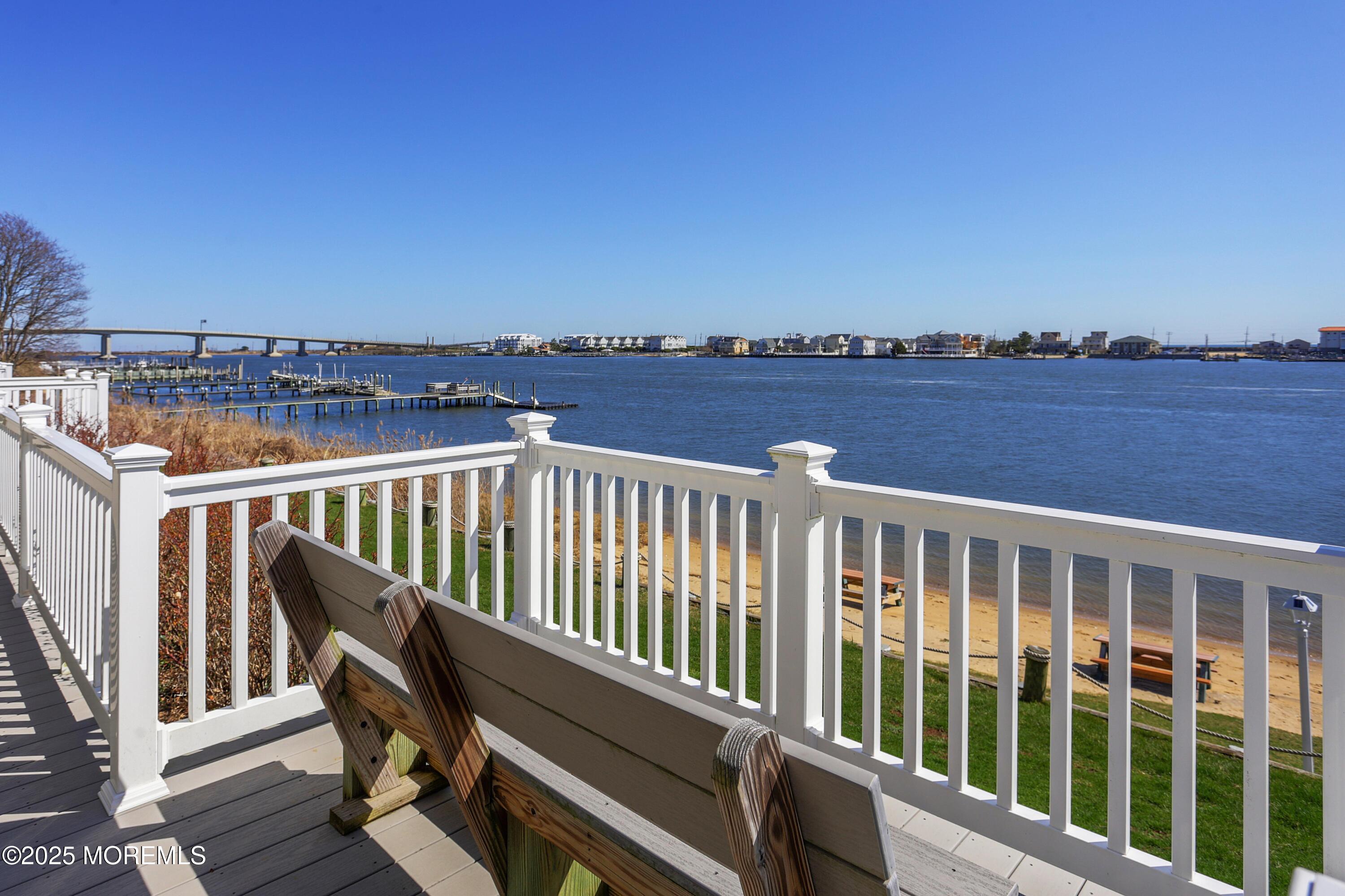 200 Portland Road, Unit C2 Highlands, NJ 07732 - Photo 14 of 20 a balcony with wooden floor and city view