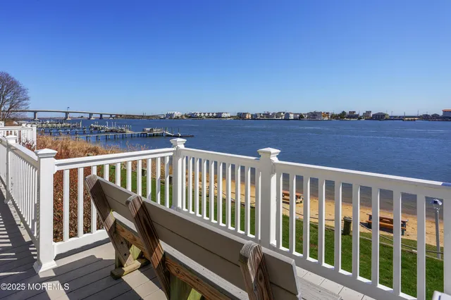 a view of a balcony with wooden floor and city view