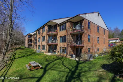 a view of a building with a yard