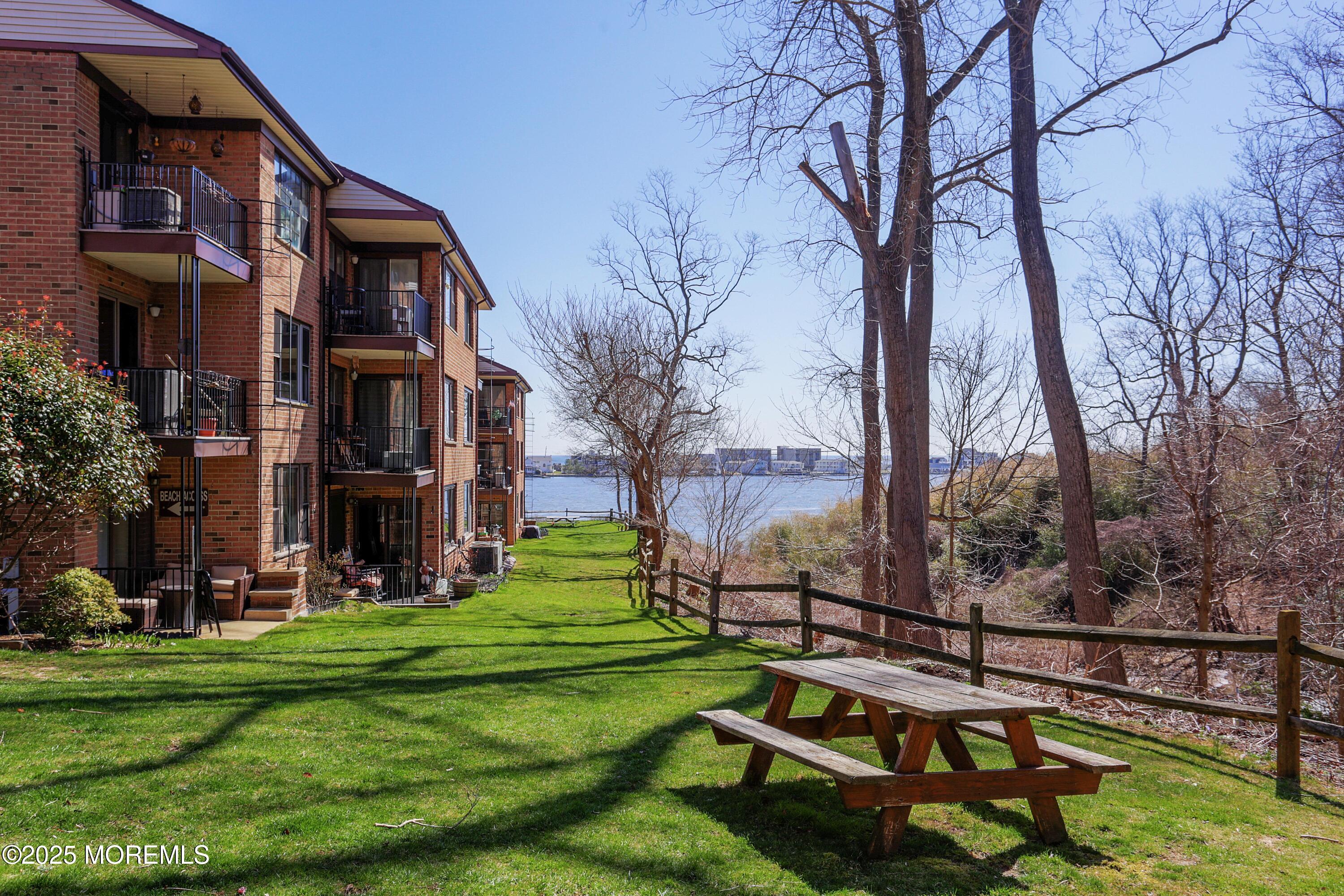 200 Portland Road, Unit C2 Highlands, NJ 07732 - Photo 18 of 20 a view of a building with a yard