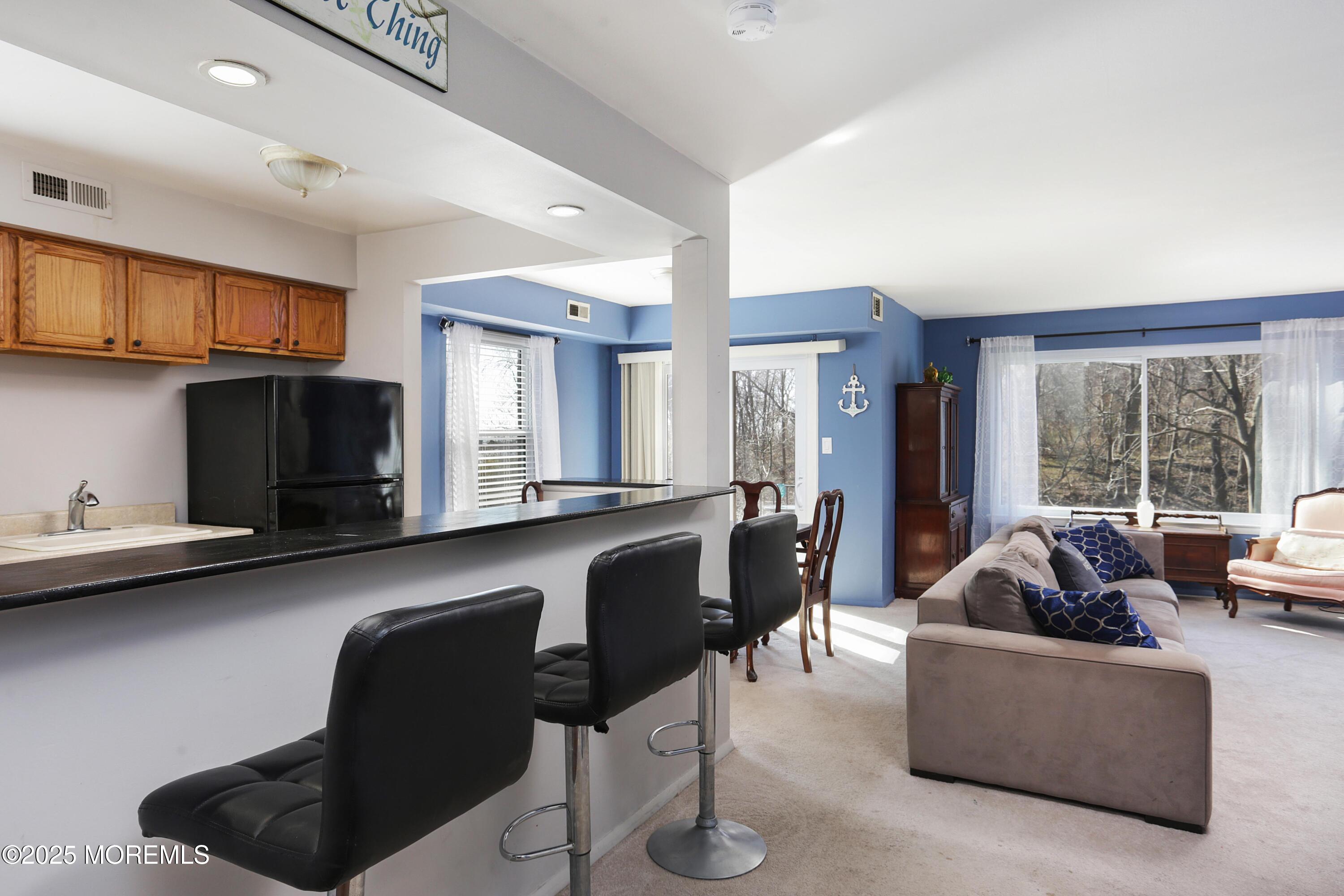 200 Portland Road, Unit C2 Highlands, NJ 07732 - Photo 3 of 20 a living room with furniture and a flat screen tv