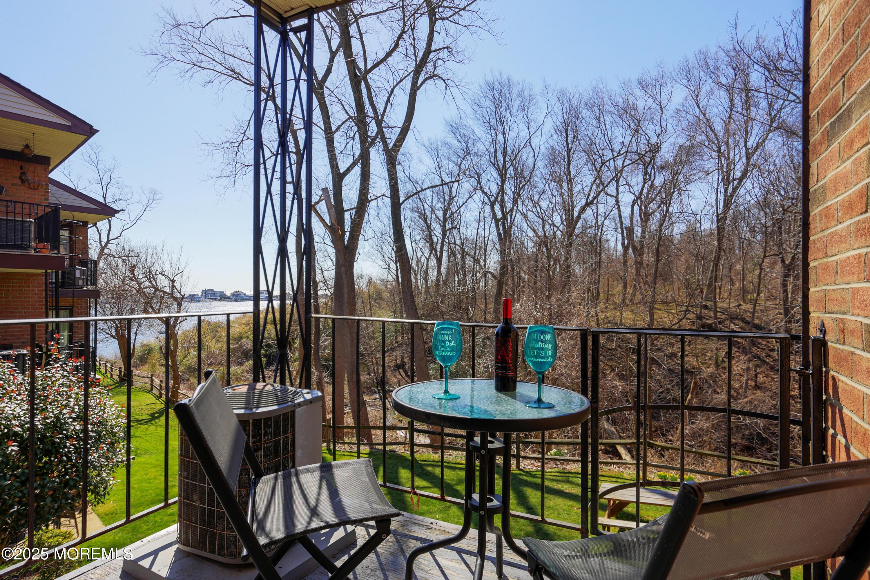 200 Portland Road, Unit C2 Highlands, NJ 07732 - Photo 10 of 20 a view of a chairs and table in the balcony
