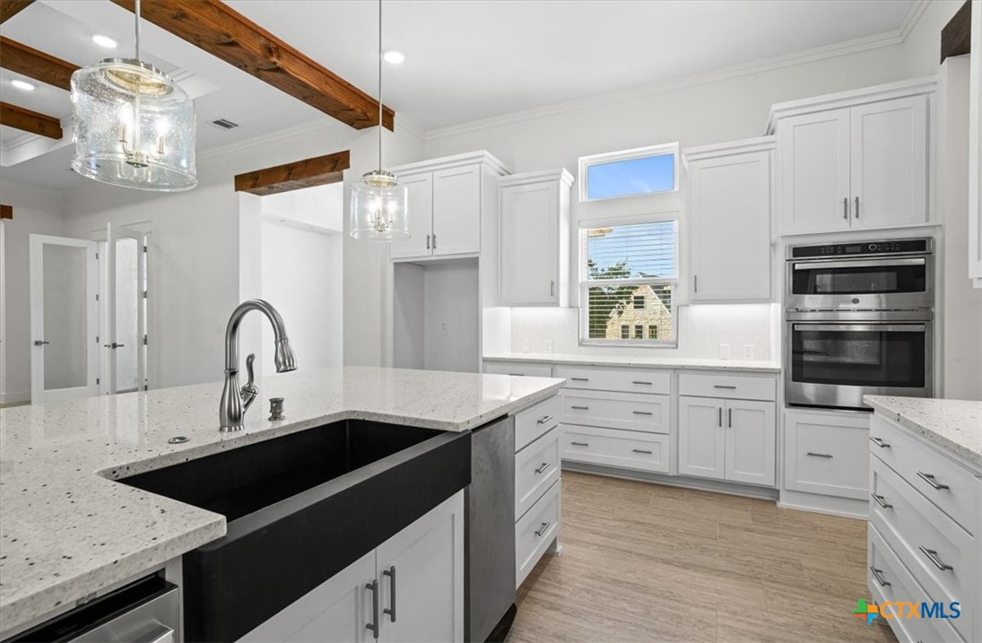 8439 Spring Creek Loop Salado, TX 76571 - Photo 14 of 40 Large composite sink with trash compactor