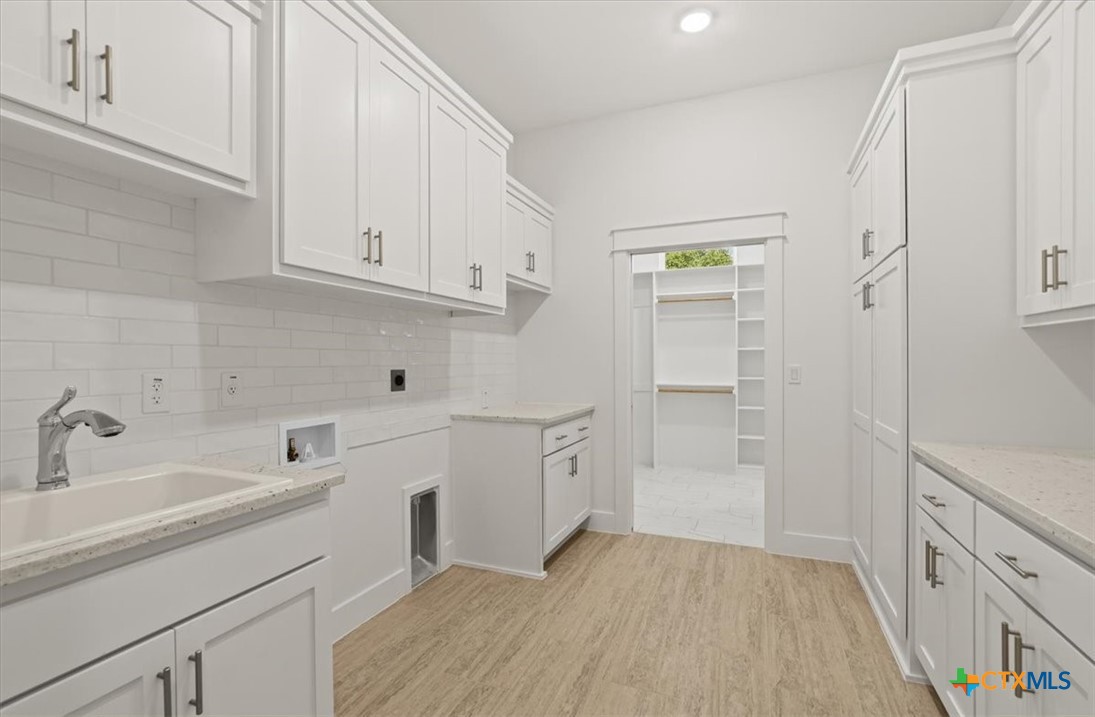 8439 Spring Creek Loop Salado, TX 76571 - Photo 25 of 40 Large Laundrt/Butler Pantry to 2nd Primary Closet