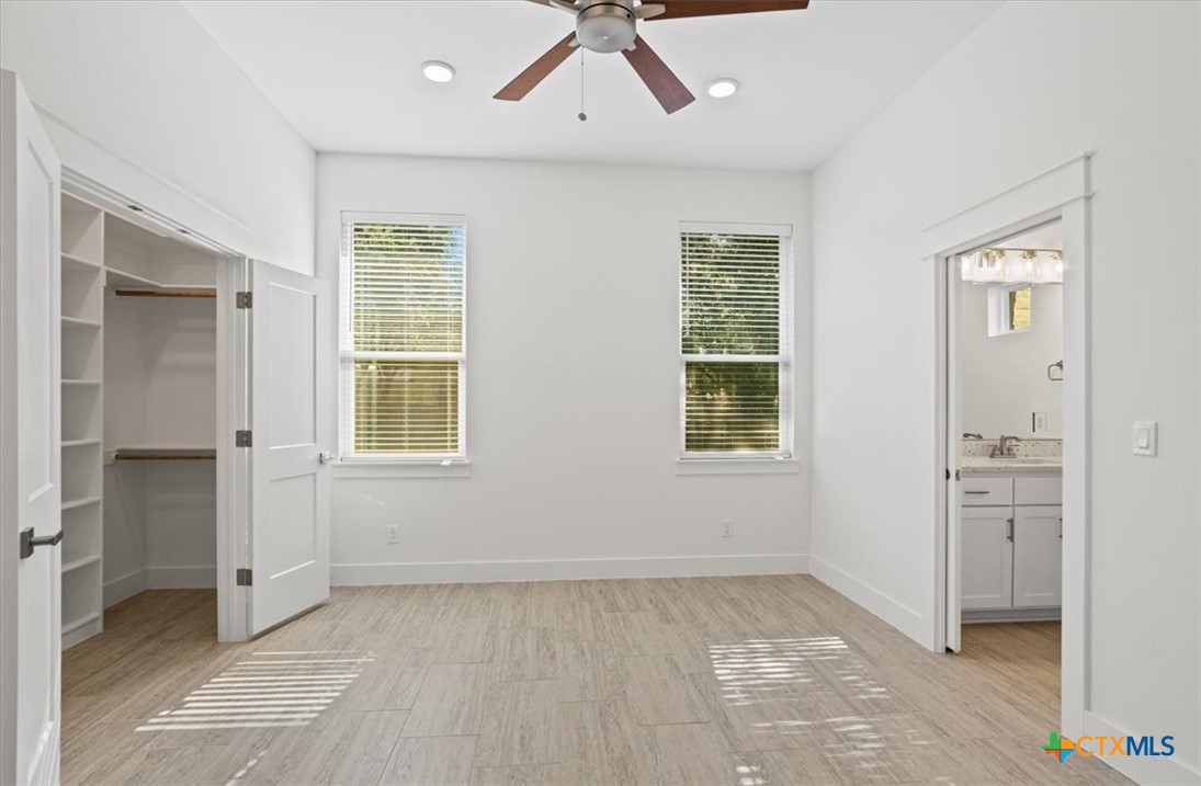 8439 Spring Creek Loop Salado, TX 76571 - Photo 30 of 40 Bedroom 2 - closet and bathroom access.