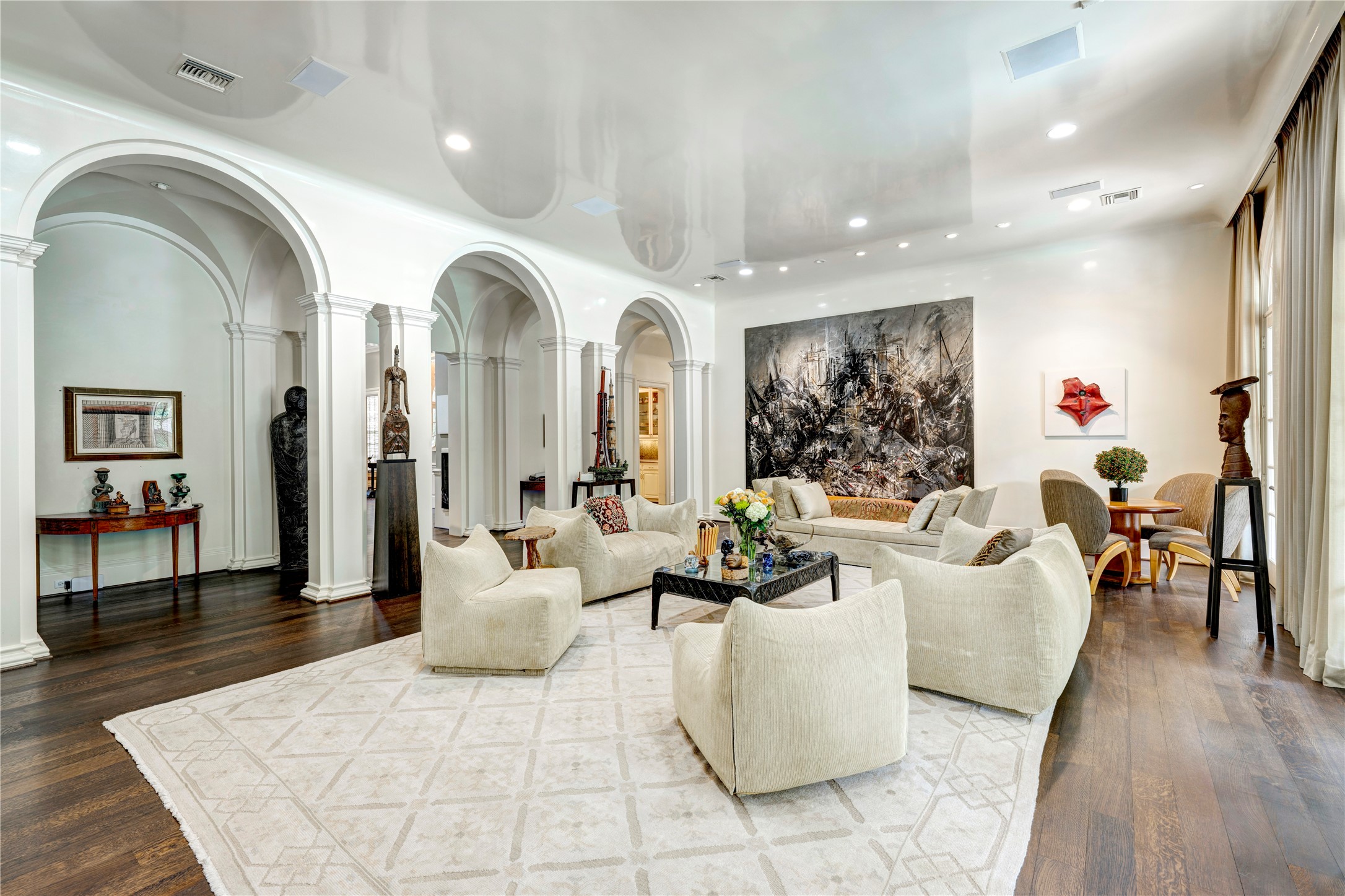 3653 Inverness Drive Houston, TX 77019 - Photo 11 of 39 Impressive grand entrance hall with striking arch openings and beautifully crafted custom columns elevating your experience, all enhanced by the elegance of a sophisticated groin ceiling treatment.