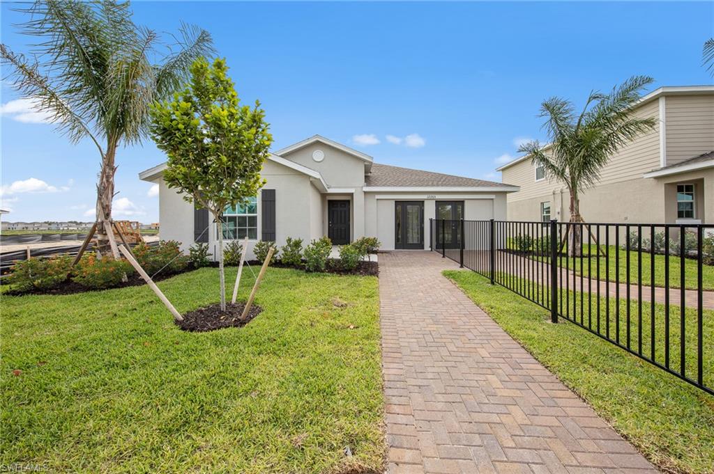 12265 Savanna Lakes Boulevard Lehigh Acres, FL 33936 - Photo 2 of 31 Single story home featuring stucco siding