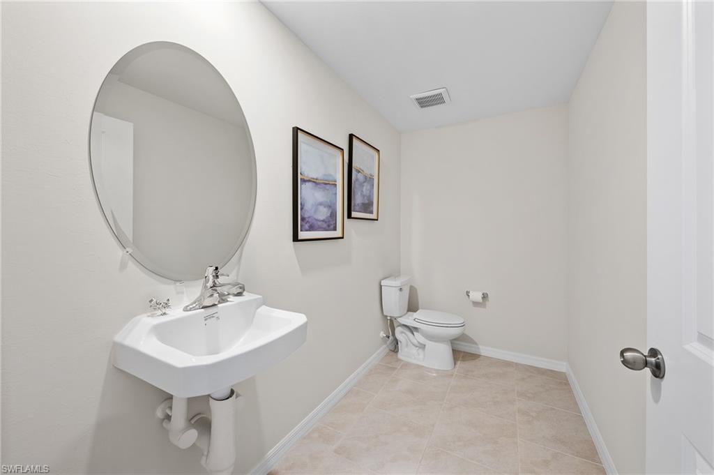 12265 Savanna Lakes Boulevard Lehigh Acres, FL 33936 - Photo 22 of 31 Bathroom with toilet and tile patterned floors
