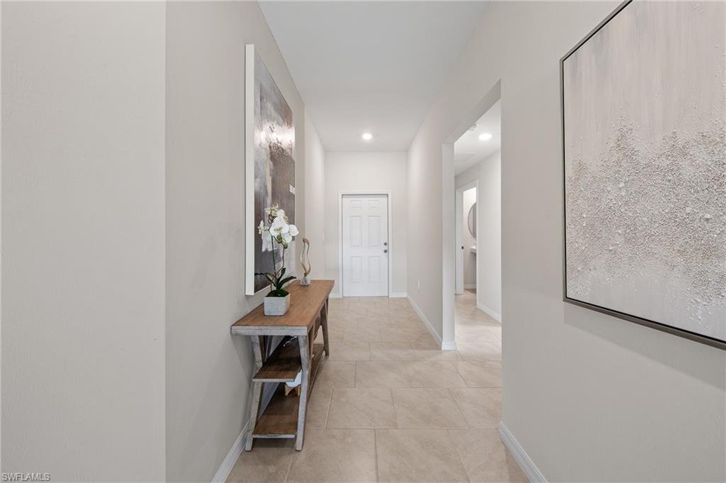 12265 Savanna Lakes Boulevard Lehigh Acres, FL 33936 - Photo 23 of 31 Corridor featuring recessed lighting and light tile patterned floors