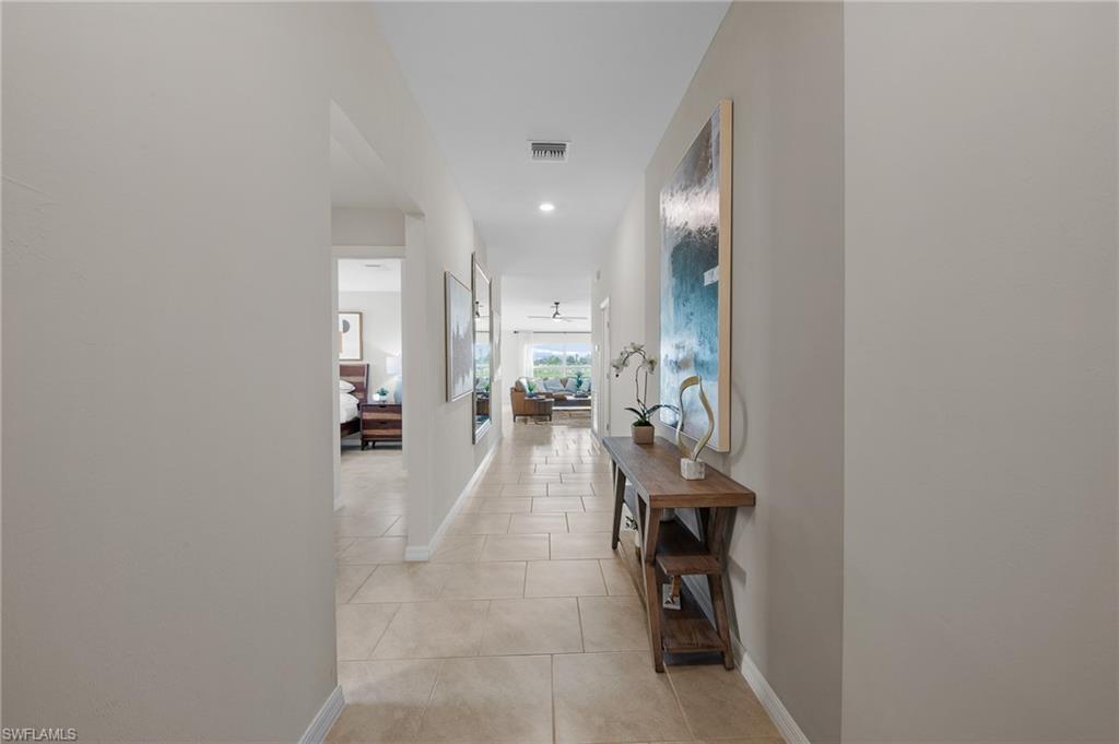 12265 Savanna Lakes Boulevard Lehigh Acres, FL 33936 - Photo 4 of 31 Corridor featuring light tile patterned floors and recessed lighting