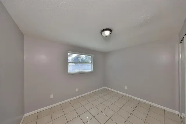 a bedroom with a bed and a table in it