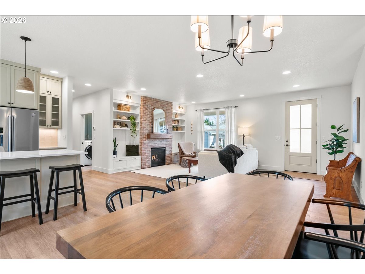 1305 Uff Da Street Silverton, OR 97381 - Photo 14 of 46 a living room with furniture a dining table and chairs