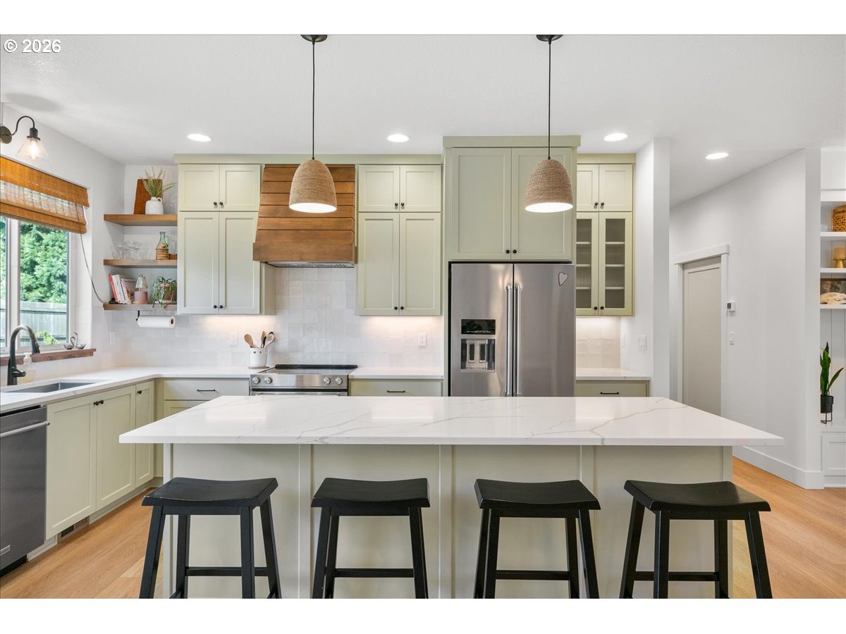 1305 Uff Da Street Silverton, OR 97381 - Photo 16 of 46 a kitchen with refrigerator and chairs