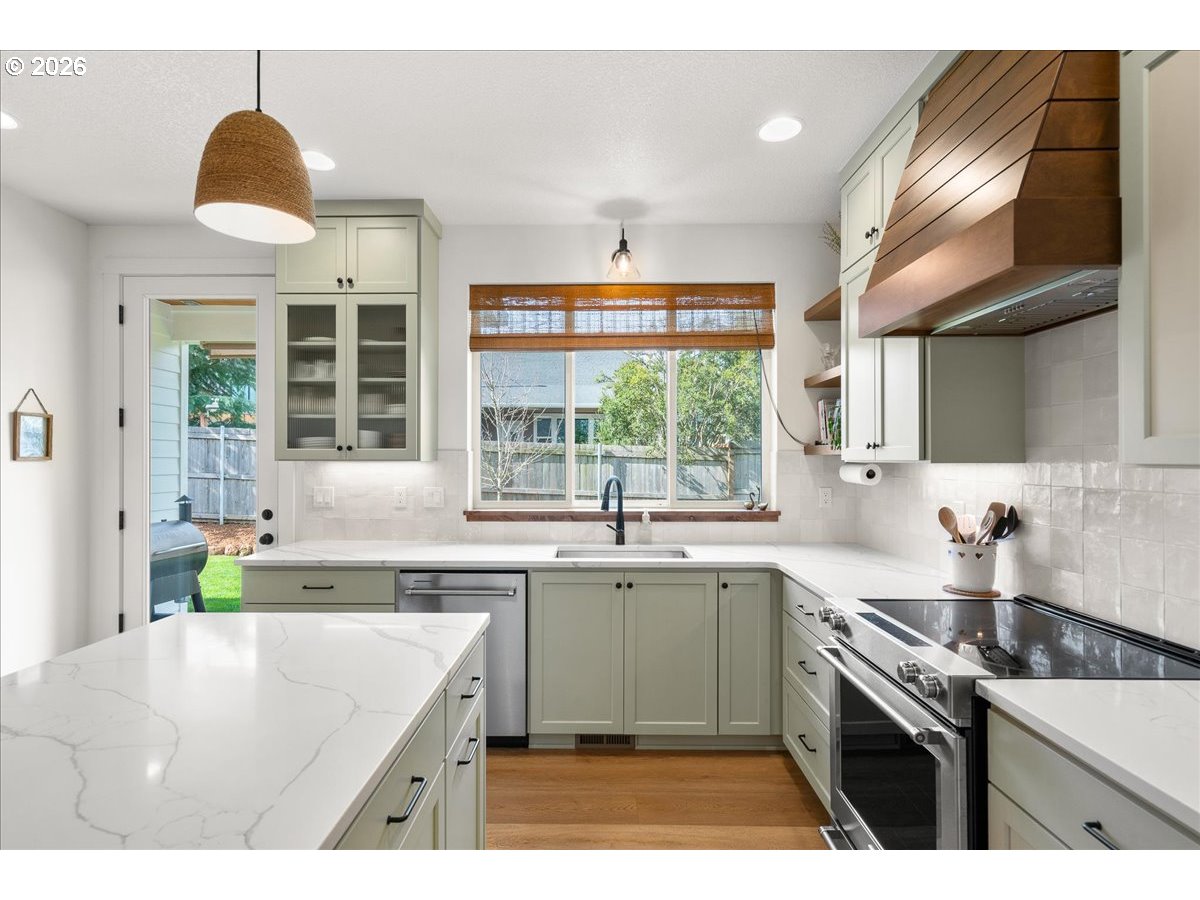 1305 Uff Da Street Silverton, OR 97381 - Photo 17 of 46 a kitchen with a sink stove and cabinets