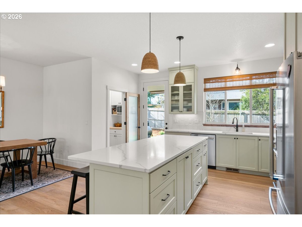 1305 Uff Da Street Silverton, OR 97381 - Photo 19 of 46 a kitchen with center island table and chairs