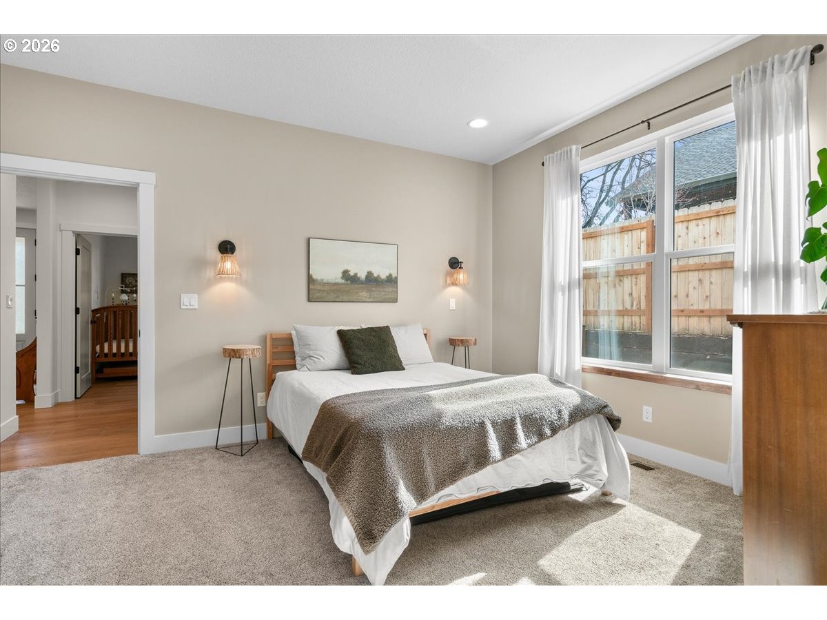 1305 Uff Da Street Silverton, OR 97381 - Photo 22 of 46 a spacious bedroom with a bed and a large window
