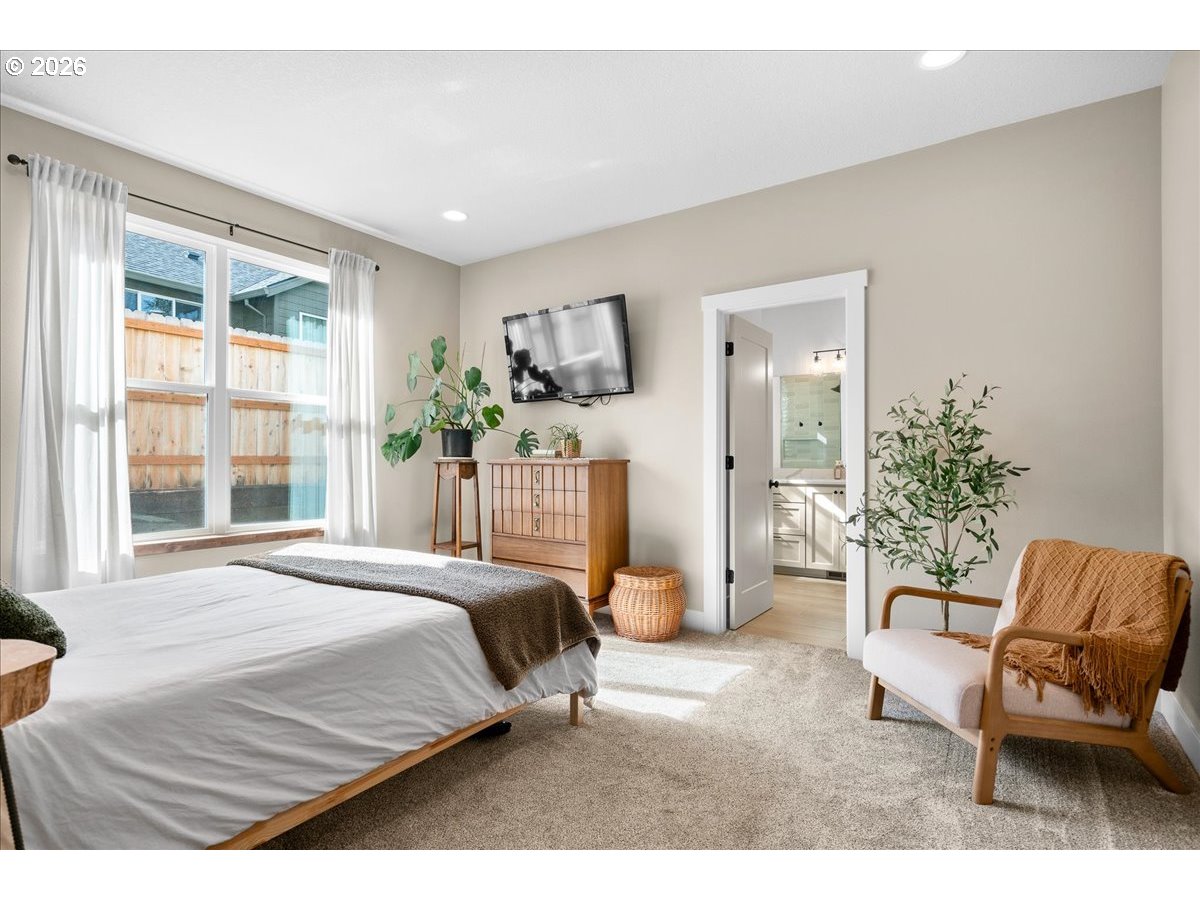 1305 Uff Da Street Silverton, OR 97381 - Photo 24 of 46 a bedroom with a bed and a chair